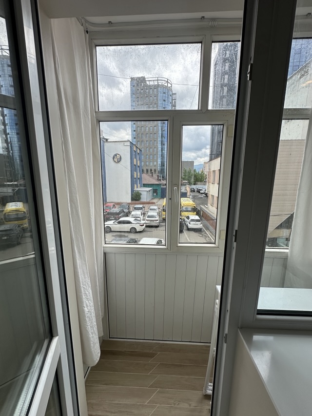 Studio with separate kitchen and balcony — Photo 9 of 10